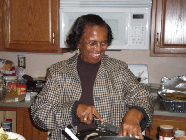 Clydia (boots) doing what she loves best, preparing food thanksgiving 2008 at Sandras house