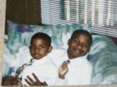 brdgettes two sons emanuel(jr) holding hs little brother curtis when they were younger