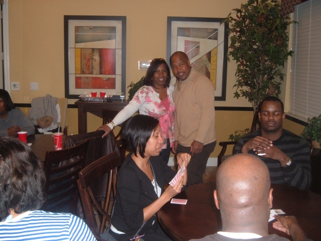 Garry Barefield and Yolonda Gibson (Barefield) in background. An intense spade game going down at the table.